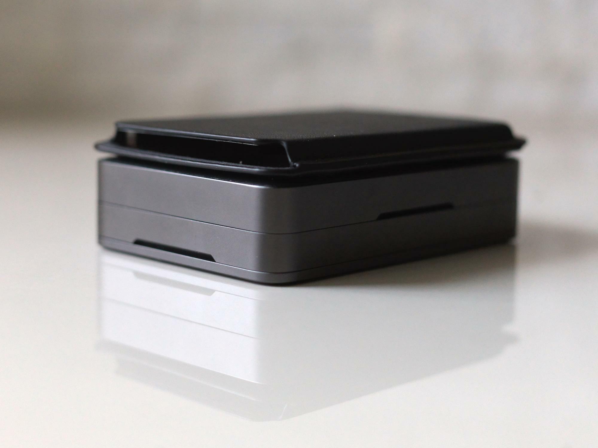 The business card case attaches magnetically on top of the cover, making it convenient to carry toge