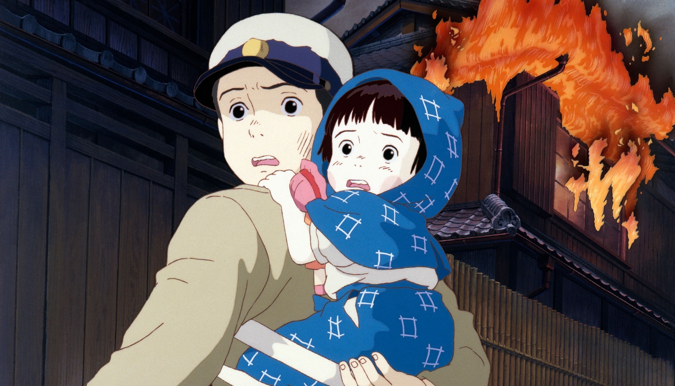 火垂るの墓のポスター。清太と節子がホタルに囲まれて座っている様子を描き、戦争の悲劇と子供たちの純粋さを象徴している。