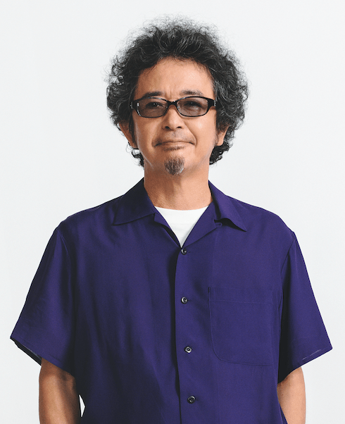 ステージでギターを演奏する奥田民生。彼の音楽と人生哲学を象徴する一枚