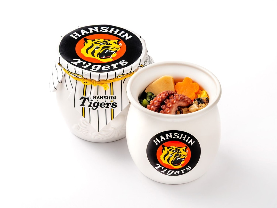 淡路屋×阪神タイガース「ひっぱりだこ飯（白）」。白い蛸壺に球団ロゴ