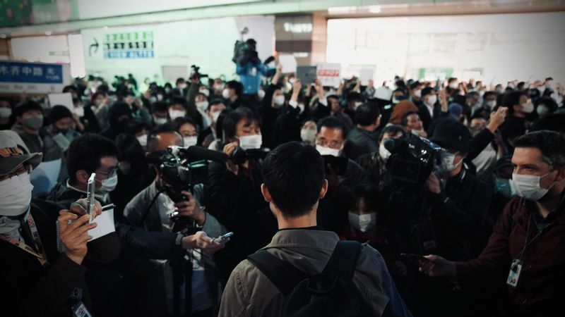 武漢出身だという男性は、メディアの取材に「独裁政権を倒したい」と語った　撮影：堀　潤