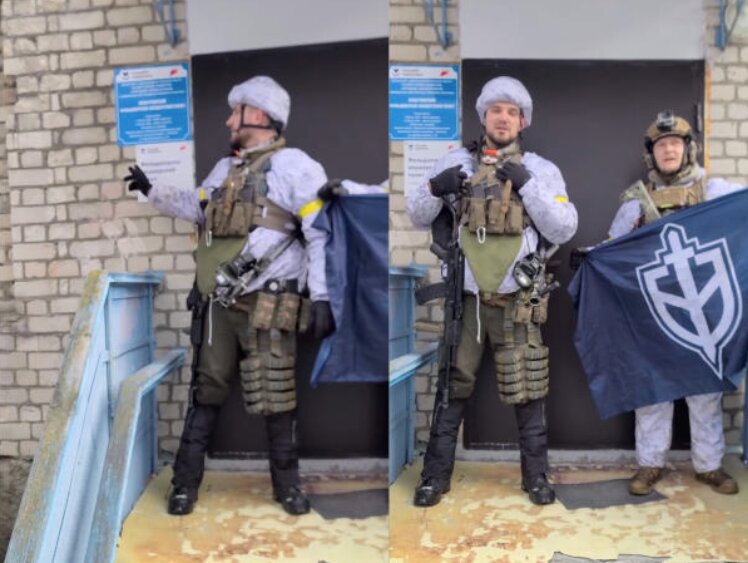 テレグラムのビデオからのキャプチャー。ロシア義勇軍団を名乗る二人が、同軍団の旗を掲げている。