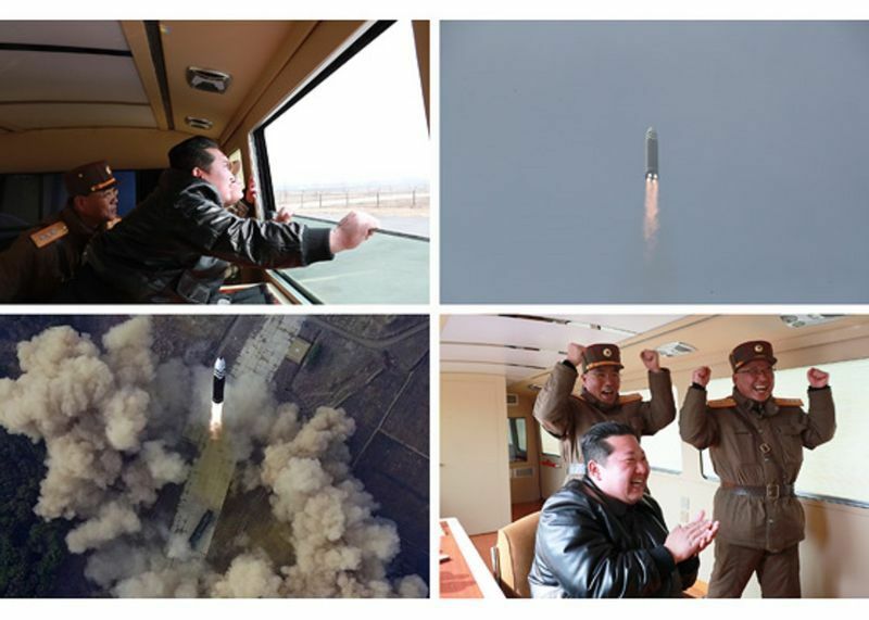 3月24日の新型ICBM「火星17」の試験発射に立ち会い、発射成功を祝う金正恩氏ら（労働新聞）